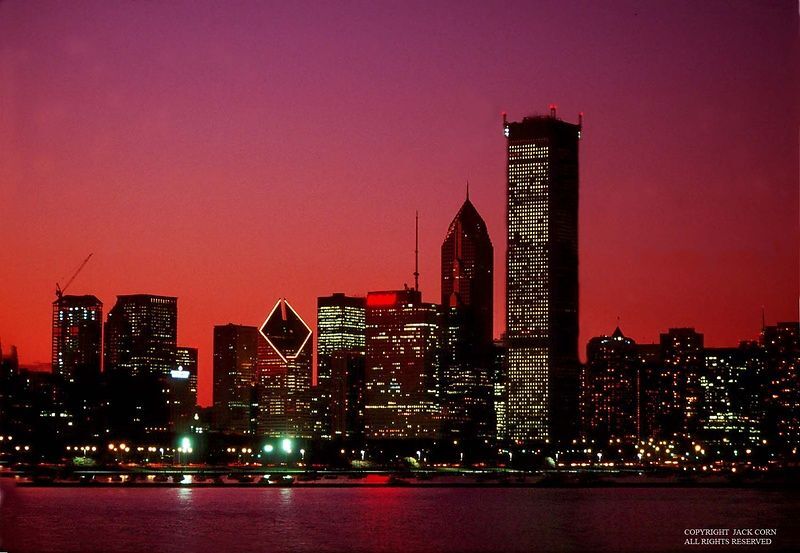 City skyline at night with tall buildings lit up against a red and purple sky.

http://jackcornphotography.photodeck.com/media/89d64dc0-2b2e-11e1-8a7c-1d9425628efb-chicago-skyline-with-red-sky